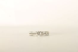 Diamond Ring, centre set with a round brilliant cut diamond, 4 claw set, shoulders set with 2 rows