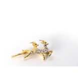 18CT PAIR OF SPRINGBOK DIAMOND SET BROOCH WITH RUB