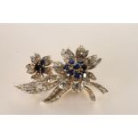 Sapphire and Diamond Flower Brooch, each flower centre set with 11 sapphires, surrounded by round
