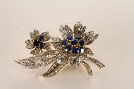 Sapphire and Diamond Flower Brooch, each flower centre set with 11 sapphires, surrounded by round