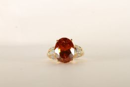 Citrine and Diamond Ring, centre set with 1 oval cut citrine, 4 claw set, shoulders and sides set