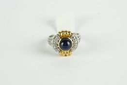 18CT TWO TONE CABOCHON SAPPHIRE AND DIAMOND RING,