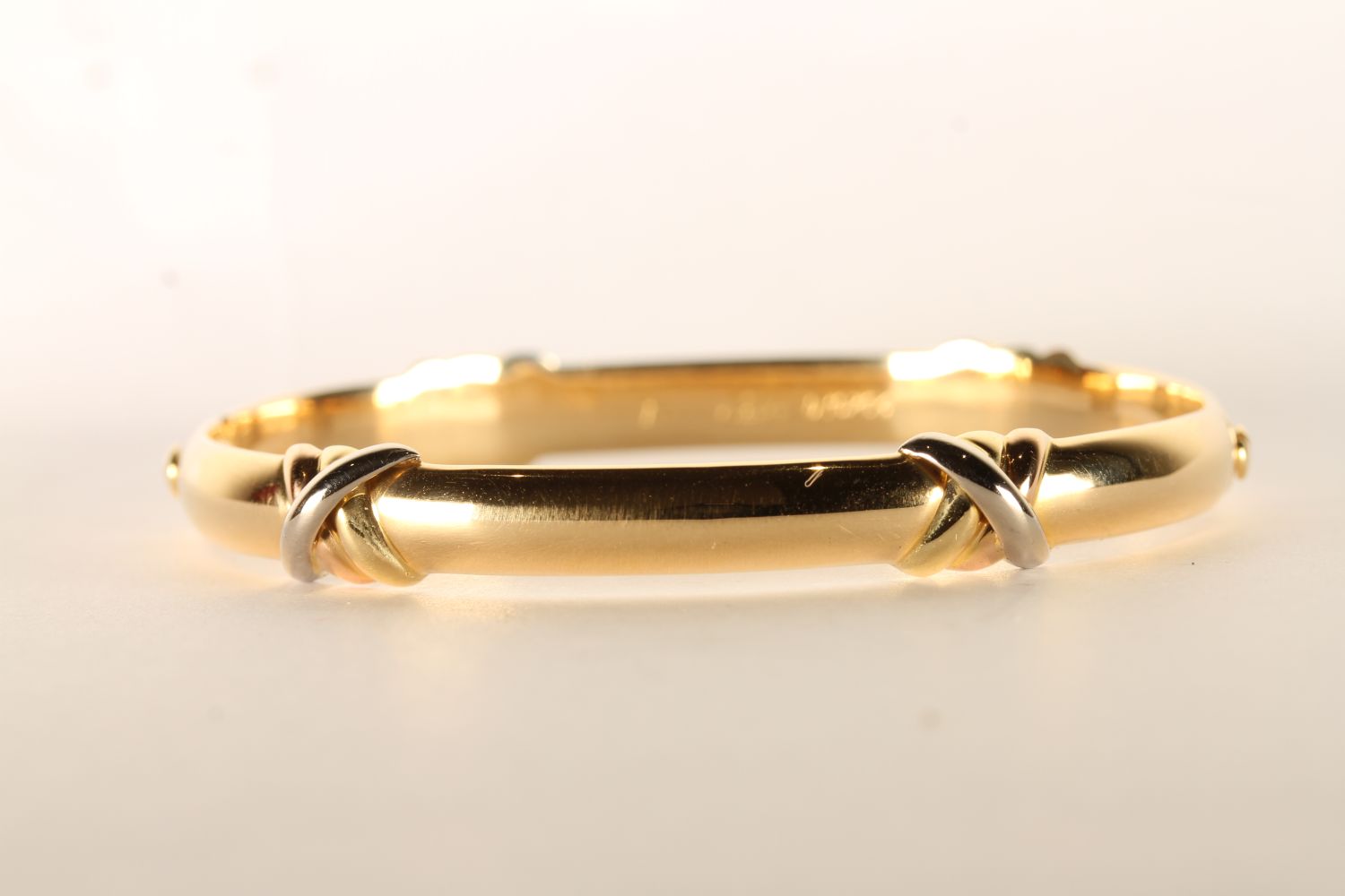 Cartier Trinity Love Bangle, featuring four criss cross 18ct rose, yellow and white gold bands, - Image 2 of 6