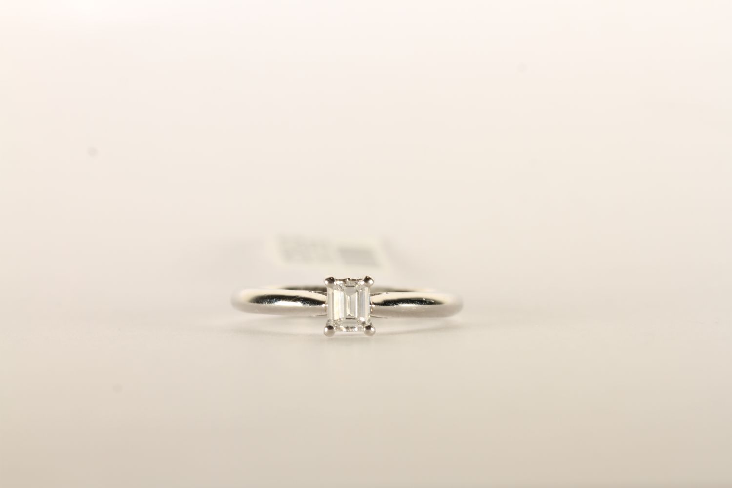 Emerald Cut Diamond Solitaire Ring, set with a sin