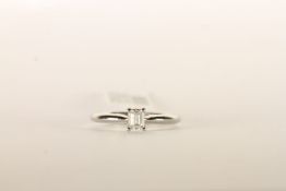 Emerald Cut Diamond Solitaire Ring, set with a sin