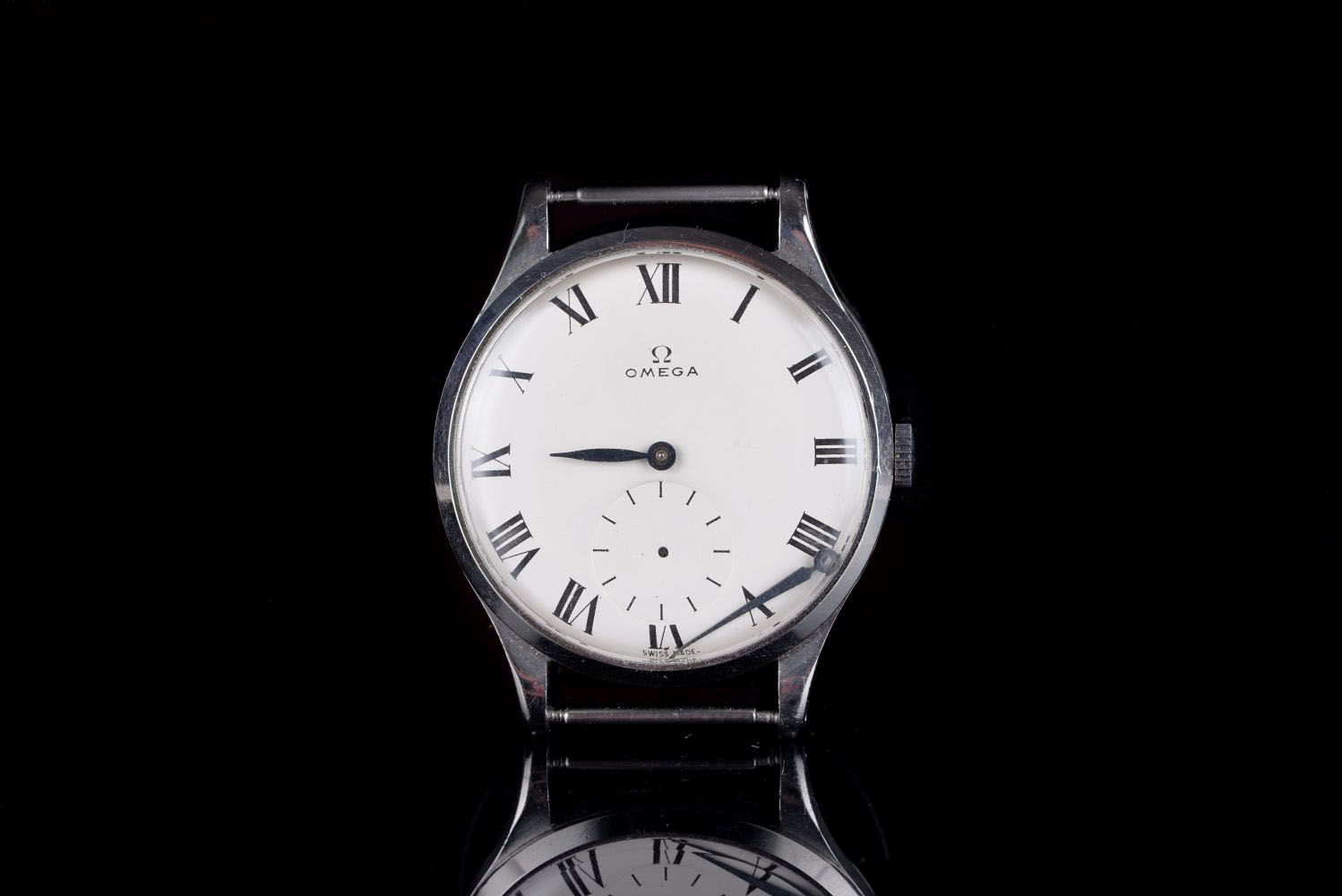 GENTLEMENS OMEGA OVERSIZE WRISTWATCH, circular off white dial with black roman numerals and gun