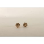 Pair of Diamond Flower Earrings, set with round brilliant cut diamonds in a flower shape, stamped