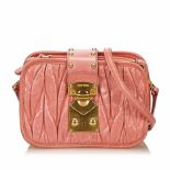 Miu Miu Gathered Leather Shoulder Bag, this shoulder bag features a gathered leather body, flat