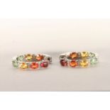 Pair of Multi-Coloured Sapphire and Diamond Hoop Earrings, set with a total of 14 oval cut yellow,
