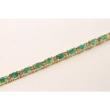 Emerald and Diamond Bracelet, set with 21 oval cut light green emeralds totalling 8.13ct, claw