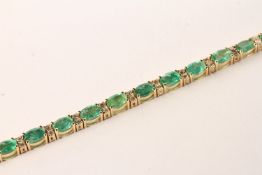 Emerald and Diamond Bracelet, set with 21 oval cut light green emeralds totalling 8.13ct, claw