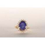 Tanzanite and Diamond Ring, set with an oval cut light violet blue tanzanite totalling 3.07ct, 4