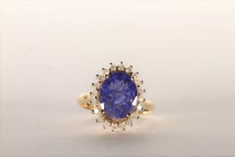 Tanzanite and Diamond Ring, set with an oval cut light violet blue tanzanite totalling 3.07ct, 4