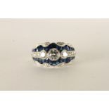 Fancy, platinum dress ring set with sapphires and diamonds