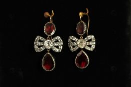 Early 20th Century Garnet and Paste set earrings, white paste stones to bow with a foil backed