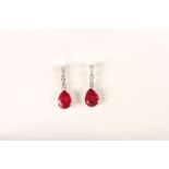 Platinum pear-cut ruby and diamond drop studs with rubberised butterflies. Rubies 2.00ct. Diamonds