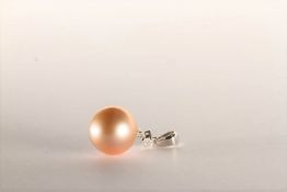 Pearl and Diamond Pendant, set with a pink South Sea Pearl, with a round brilliant cut Diamond 0.