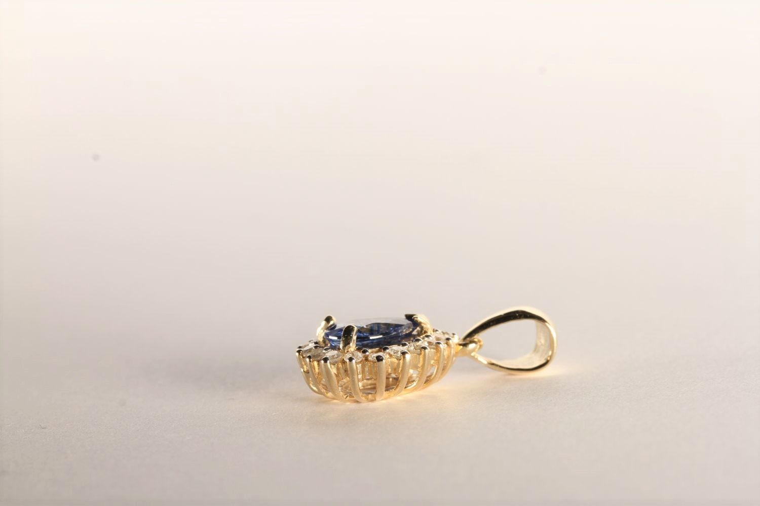 Sapphire and Diamond Pendant, set with a pear cut medium blue sapphire totalling 1.20ct, claw set, - Image 2 of 3