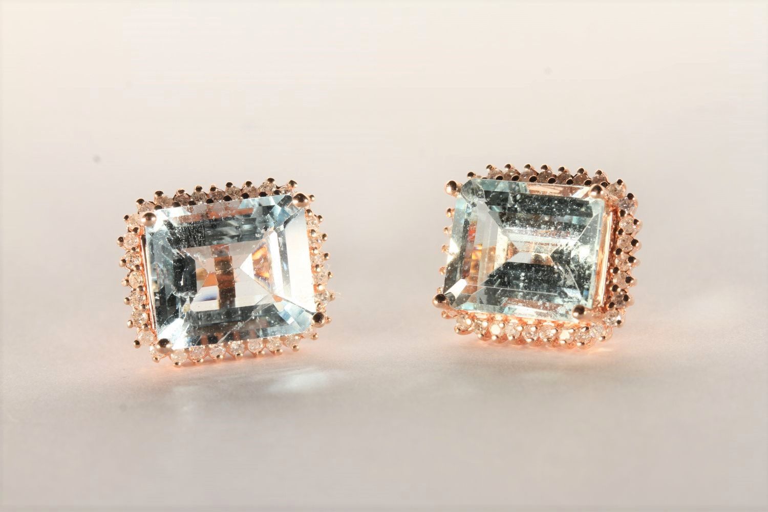 Pair of Aquamarine and Diamond Stud Earrings, set with 2 emerald cut aquamarines totalling 7.74ct,