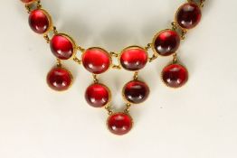 Victorian 15ct Cabochon Amber Necklace, graduating cabochon cut stones, foil backed, tested as