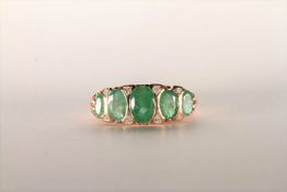 Emerald and Diamond Ring, set with 5 oval cut medium green emeralds totalling 2.00ct, bezel set,