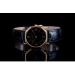 GENTLEMENS RAYMOND WEIL WRISTWATCH, circular black dial with gold hour markers and hands, 31mm