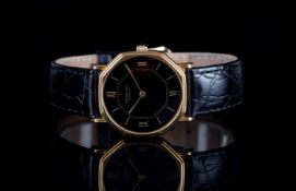 GENTLEMENS RAYMOND WEIL WRISTWATCH, circular black dial with gold hour markers and hands, 31mm