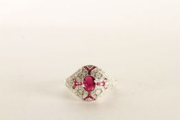 Platinum Victorian-style Ruby and Diamond Dress Ring, set with a central oval-cut ruby and pierced
