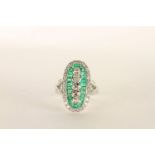 Platinum Emerald and Diamond ring, set vertically with 5 old-cut diamonds, surrounded by calibre-cut
