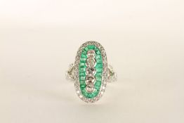 Platinum Emerald and Diamond ring, set vertically with 5 old-cut diamonds, surrounded by calibre-cut