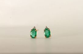 Pair of Emerald and Diamond Earrings, each set with an oval cut emerald, 4 claw set, each set with a