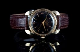 GENTLEMENS ULYSEE NARDIN CHRONOMETER WRISTWATCH, circular black gilt dial with gold hour markers and