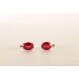 Pair of 18ct White Gold Ruby and Diamond Stud Earrings, set with oval cut Rubies approximate total