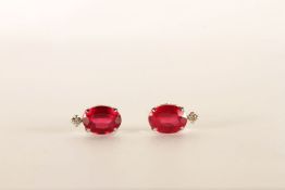 Pair of 18ct White Gold Ruby and Diamond Stud Earrings, set with oval cut Rubies approximate total