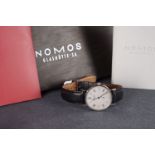 GENTLEMENS NOMOS TANGENTE LTD EDITION 31/100 WRISTWATCH W/ BOX & PAPERS, circular silver dial with