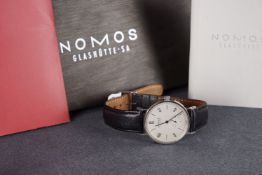 GENTLEMENS NOMOS TANGENTE LTD EDITION 31/100 WRISTWATCH W/ BOX & PAPERS, circular silver dial with