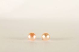***TO BE SOLD WITHOUT RESERVE - EX SHOP STOCK*** Pair of pink pearl stud earrings, stamped 9ct