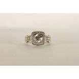 Diamond Cluster Ring, centre set with a round brilliant cut diamond, 4 claw set, shoulders and sides