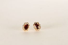 ***TO BE SOLD WITHOUT RESERVE - EX SHOP STOCK*** Pair of garnet stud earrings, stamped 9ct yellow