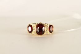 ***TO BE SOLD WITHOUT RESERVE - EX SHOP STOCK*** Garnet and Diamond Ring, stamped 18ct yellow