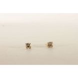 Pair of Diamond Stud Earrings, each set with a single round brilliant cut diamonds, 4 claw set,