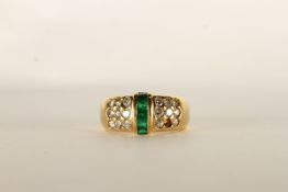 Emerald and Diamond Ring, set with baguette cut emeralds to the centre, surrounded by round