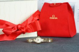 LADIES 9CT OMEGA DRESS WATCH W/BOX, circular dial with gold baton hour markers, polished gold case