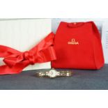 LADIES 9CT OMEGA DRESS WATCH W/BOX, circular dial with gold baton hour markers, polished gold case