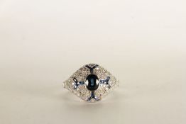 Victorian-Style Sapphire and Diamond Ring, set with a central oval cut sapphire, filigree mount