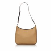 Prada Leather Shoulder Bag, this shoulder bag features a leather body, a flat strap, an open top,