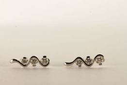 Pair of Diamond Trilogy Earrings, each set with 3 round brilliant cut diamonds, stamped 18ct white