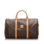 Celine Macadam Travel Bag, this travel bag features a PVC body, an exterior slip pocket, rolled