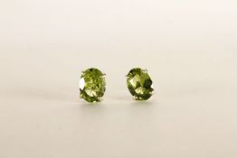 Pair of Peridot Stud Earrings, each set with an oval cut peridot, 4 claw set, stamped sterling