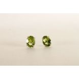 Pair of Peridot Stud Earrings, each set with an oval cut peridot, 4 claw set, stamped sterling